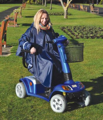 Female sat in scooter with blue cover