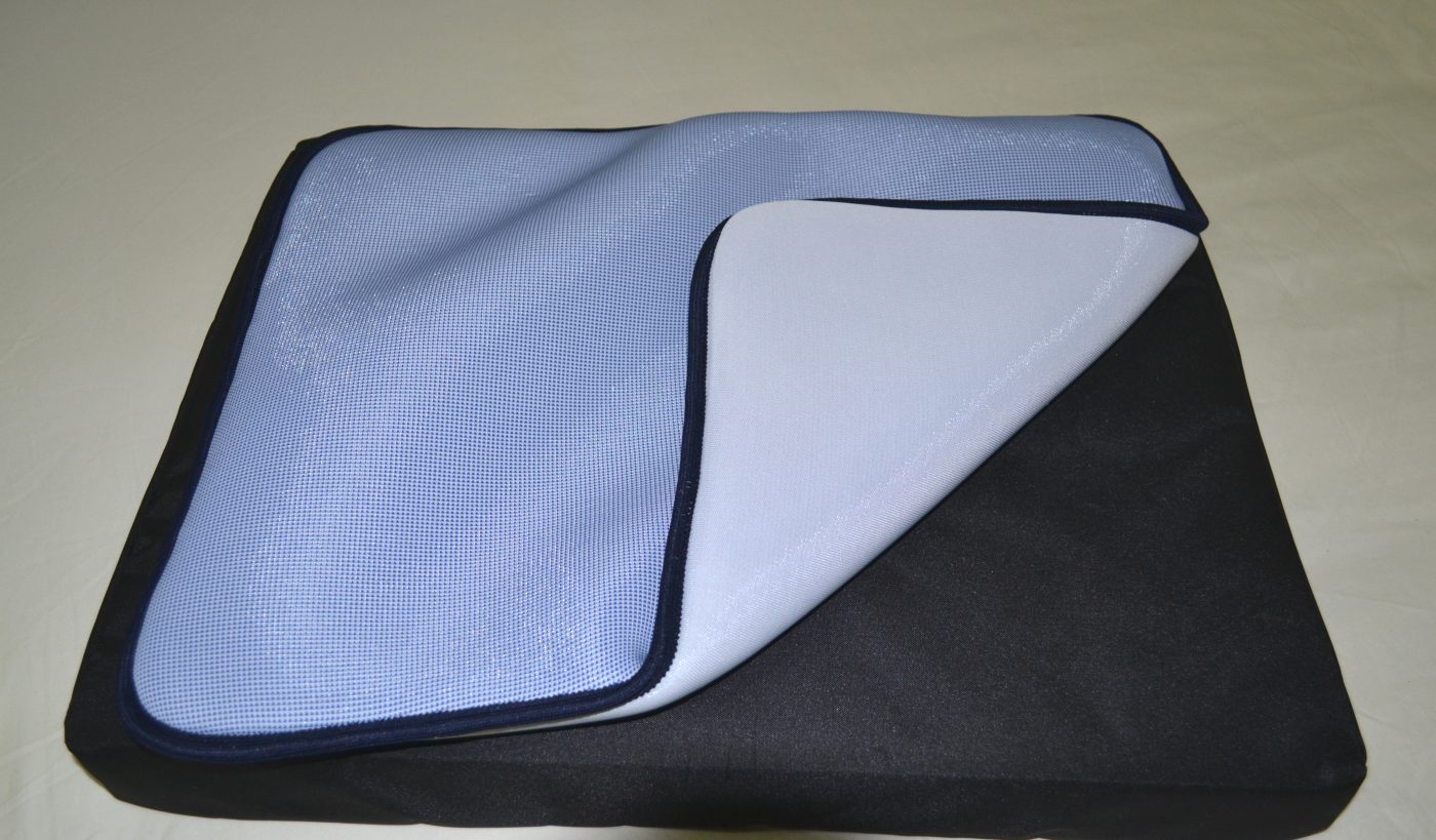 Pale blue seat pad with black cushion.
